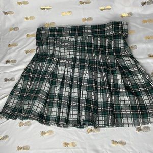 Pleated tennis mini skirt in green plaid